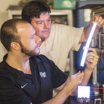 Wake Forest University physics professor, David Carroll, works with graduate student Greg Smith on new FIPEL lighting technology.